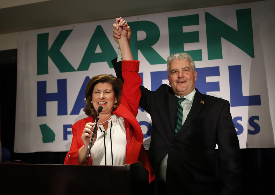 <p>Republican candidate for Georgia’s 6th District Congressional seat Karen Handel celebrates with her husband Steve as she declares victory during an election-night watch party Tuesday, June 20, 2017, in Atlanta. (Photo: John Bazemore/AP) </p>