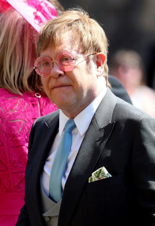 British singer-songwriter Elton John leaves after attending the wedding ceremony of Britain's Prince Harry, Duke of Sussex and US actress Meghan Markle at St George's Chapel, Windsor Castle