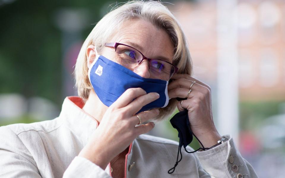 Anja Karliczek, German minister for Education and Research puts on a face mask during her visit to the Hamburg-Eppendorf university clinic - Pool/Reuters