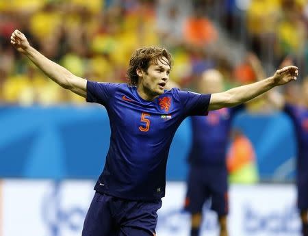 Daley Blind of the Netherlands celebrates scoring their second goal during their 2014 World Cup third-place playoff against Brazil at the Brasilia national stadium in Brasilia July 12, 2014. REUTERS/Dominic Ebenbichler