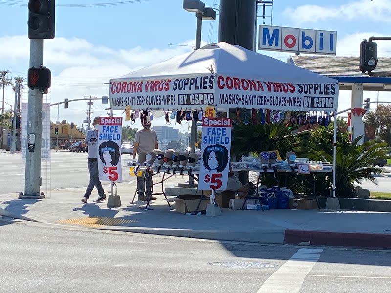 Masks and protective gear being sold at street corner during global outbreak of the coronavirus disease (COVID-19), in Culver City