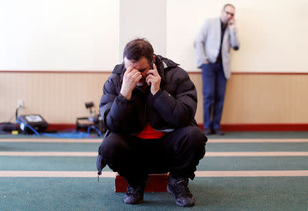 A man speaks on the phone at the Quebec Islamic Cultural Centre in Quebec City, February 1, 2017. REUTERS/Mathieu Belanger