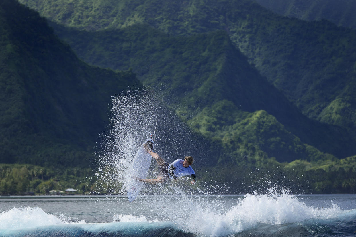 Surfer above wave.