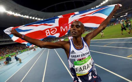 2016 Rio Olympics - Athletics - Final - Men's 10,000m Final - Olympic Stadium - Rio de Janeiro, Brazil - 13/08/2016. Mo Farah (GBR) of Britain celebrates winning the race. REUTERS/Kai Pfaffenbach