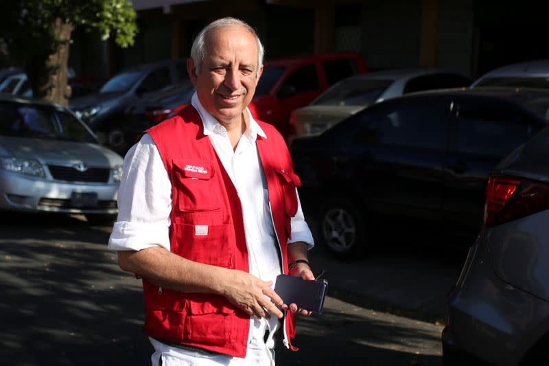 Sigfrido Reyes leaves after a news conference in San Salvador