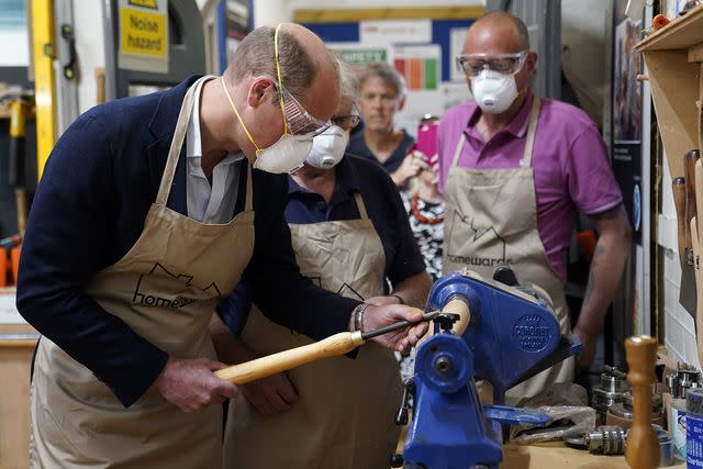 <p>Andrew Matthews - WPA Pool/Getty Images</p> Prince William visits Faithworks Carpentry Workshop on June 26