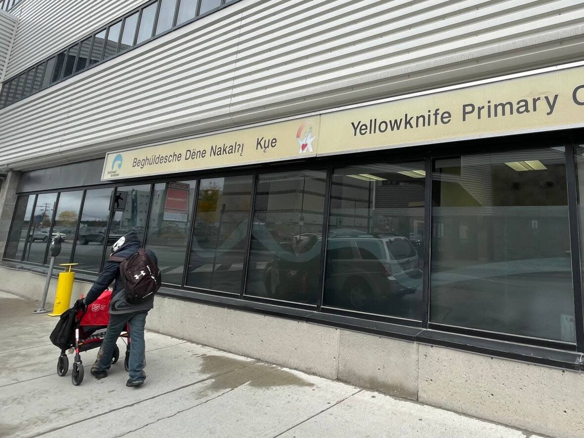 A man walks past the Yellowknife Primary Care Clinic on Oct. 7, 2021. The clinic's lab and diagnostic imaging services will be shut down this summer. (Walter Strong/CBC - image credit)