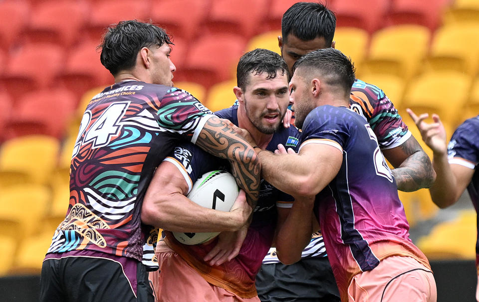 BRISBANE, AUSTRALIA - MARCH 11: Corey Oates is tackled during a Brisbane Broncos NRL training session at Suncorp Stadium on March 11, 2024 in Brisbane, Australia. (Photo by Bradley Kanaris/Getty Images)