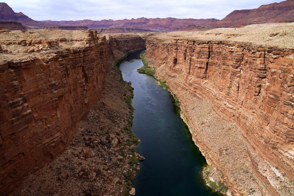 The Colorado River in the upper River Basin is pictured Friday, May 29, 2021, in Lees Ferry, Ariz. Included in the infrastructure deal that became law last month is $2.5 billion for Native American water rights settlements, which quantify individual tribes’ claims to water and identify infrastructure projects to help deliver it to residents. On the Navajo Nation, the largest reservation in the U.S., the money could fund a settlement reached in 2020 over water in the upper Colorado River basin. (AP Photo/Ross D. Franklin)