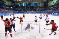 <p>Alina Muller #25 of Switzerland celebrates after scoring a goal against So Jung Shin #31 of Korea in the first period during the Women’s Ice Hockey Preliminary Round – Group B game on day one of the PyeongChang 2018 Winter Olympic Games at Kwandong Hockey Centre on February 10, 2018 in Gangneung, South Korea. (Photo by Bruce Bennett/Getty Images) </p>