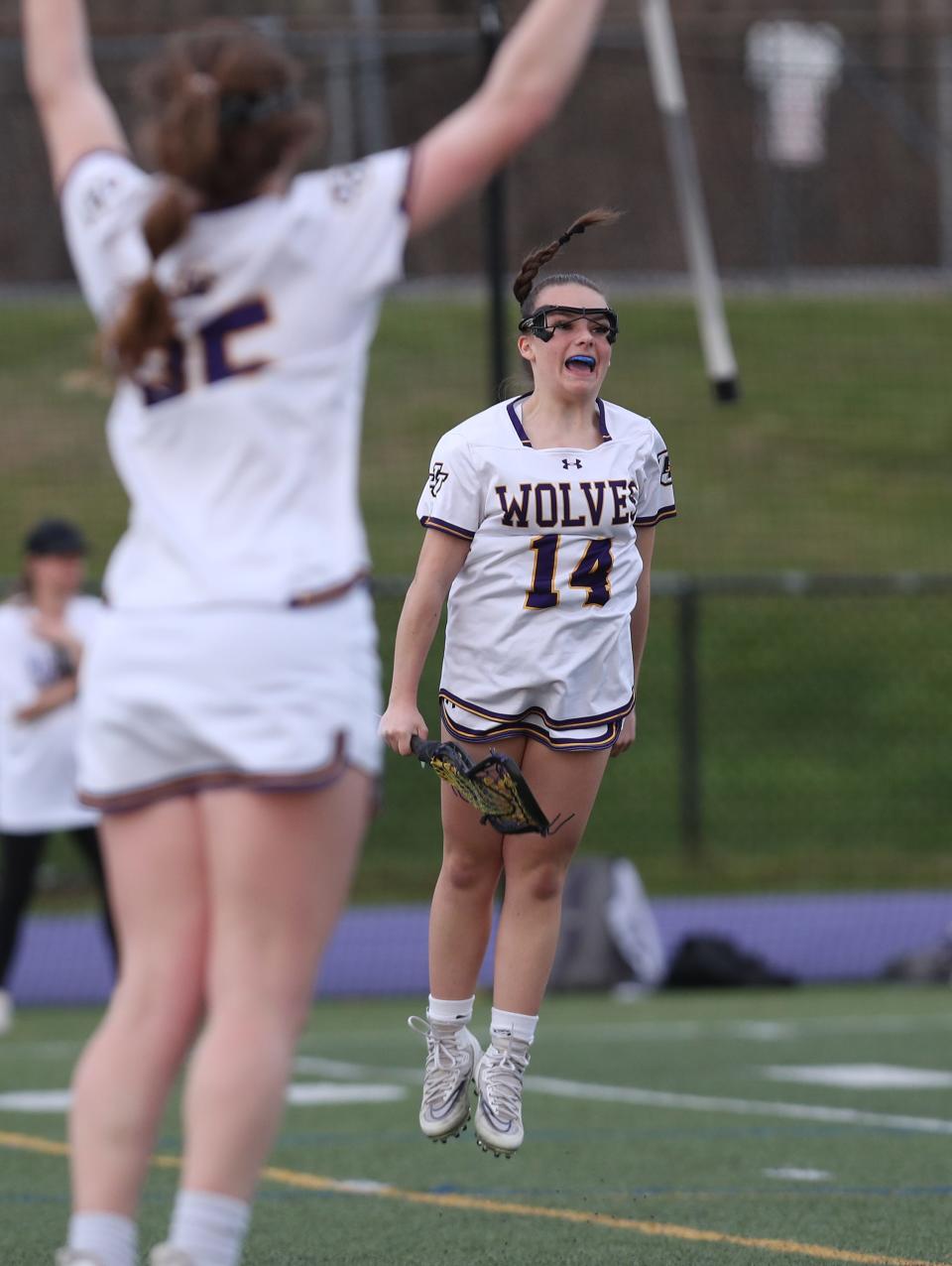 John Jay's Nicole DiNapoli (14) celebrates her second half goal against Suffern's during girls lacrosse action at John Jay High School in Cross River High  April 11, 2023. John Jay won the game 17-9.