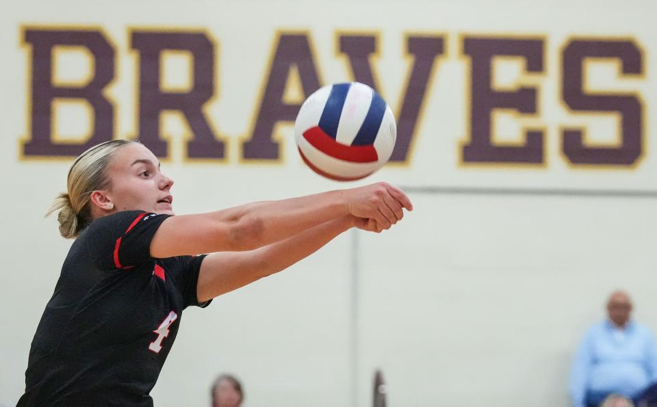 Center Grove Trojans Sophie Sabol (4) leaps to hit the ball Thursday, Sept. 14, 2023, during the game at Brebeuf Jesuit Preparatory School in Indianapolis. The Center Grove Trojans defeated Brebeuf Jesuit, 3-2.