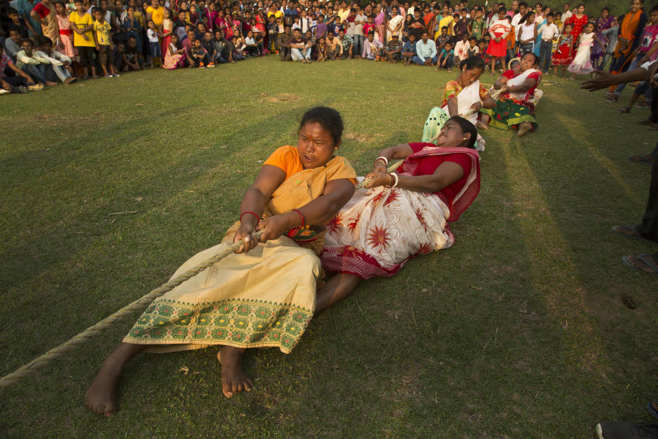 In this April 20, 2019, file photo, Indian women participate in a tug-of-war during Suwori Tribal festival in Boko, west of Gauhati, India. (AP Photo/Anupam Nath, File)