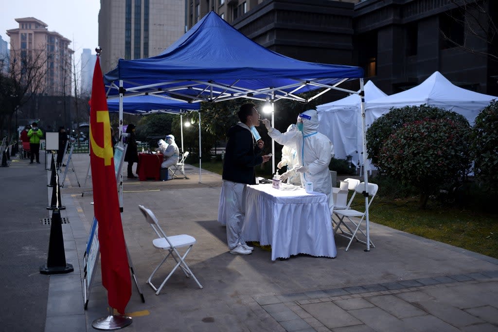 File: A resident undergoes a nucleic acid test for Covid at a residential area that is under restrictions following a recent coronavirus outbreak in Xi’an (Getty Images)