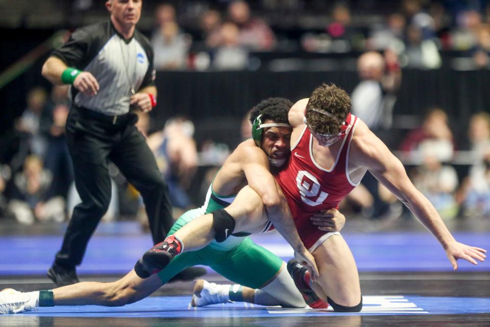 Utah Valley's Demetrius Romero takes down Oklahoma's Tate Picklo during day one of the NCAA Wrestling Championships 2023 at the BOK Center in Tulsa, Okla. on Thursday, March 16, 2023.