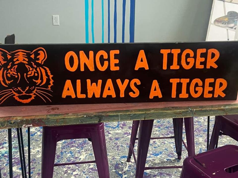 Make a high school spirit board like this at Fresh Memories studio in Hopewell Township.