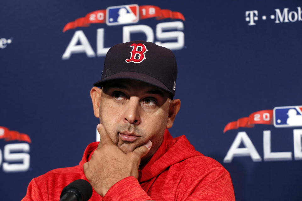 Boston Red Sox manager Alex Cora listens to a reporter's question before a baseball workout at Fenway Park, Thursday, Oct. 4, 2018, in Boston, in preparation for Game 1 of the ALDS against the New York Yankees on Friday. (AP Photo/Elise Amendola)