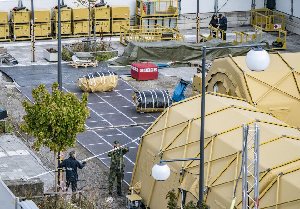 Military and personnel from the National Swedish Board of Health and Welfare dismantle a field hospital in Helsingborg, Sweden, Wednesday Sept. 9, 2020. Sweden's relatively low-key approach to coronavirus lockdowns captured the world's attention when the pandemic first hit Europe. But it also had a per capita death rate much higher than other Nordic countries. Now, as infection numbers surge in much of Europe, Sweden has some of the lowest numbers of new cases and there are only 14 people being treated for the virus in intensive care in the country of 10 million. (AP Photo/TT News Agency/Johan Nilsson)