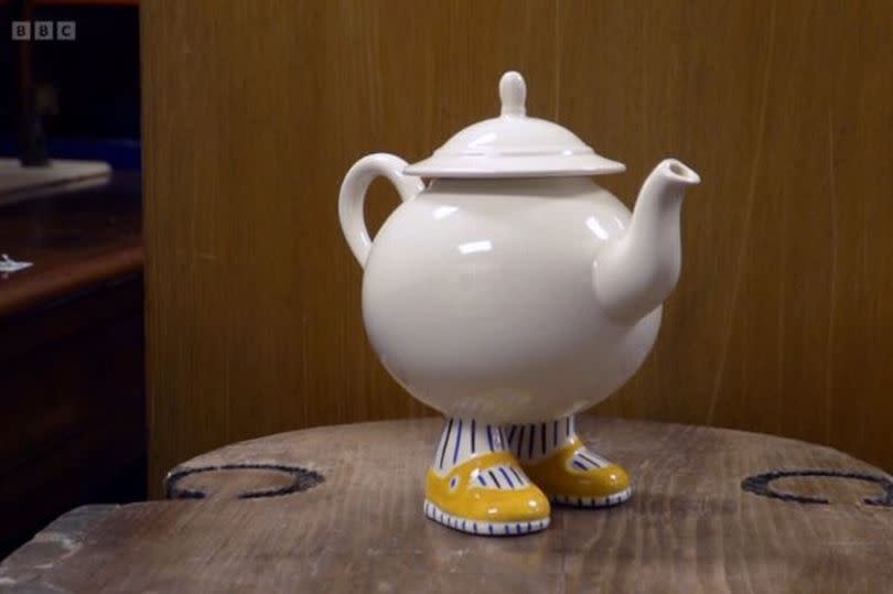 The quirky teapot that had pinstripe legs and yellow shoes