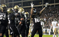 Colorado wide receiver Xavier Weaver, right, celebrates after catching a pass to complete a two-point conversion in the second overtime of an NCAA college football game against Colorado State Saturday, Sept. 16, 2023, in Boulder, Colo. (AP Photo/David Zalubowski)