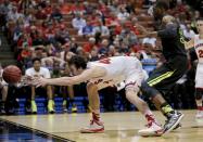 Wisconsin forward Frank Kaminsky, left, reaches for the ball as Baylor forward Cory Jefferson defends during the second half of an NCAA men's college basketball tournament regional semifinal, Thursday, March 27, 2014, in Anaheim, Calif. (AP Photo/Jae C. Hong)
