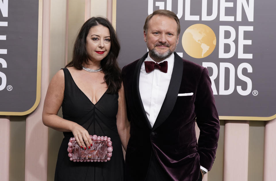 Rian Johnson, right, and Karina Longworth arrive at the 80th annual Golden Globe Awards at the Beverly Hilton Hotel on Tuesday, Jan. 10, 2023, in Beverly Hills, Calif. (Photo by Jordan Strauss/Invision/AP)