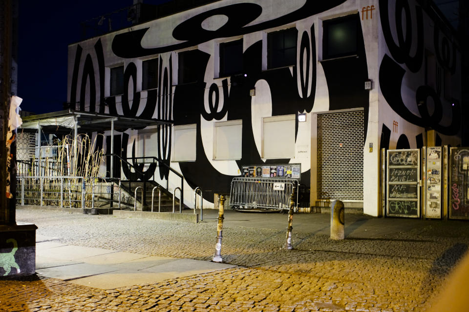 In this March 21, 2020, photo, an entrance door of music club Watergate is closed in Berlin, Germany. The nightclubs in the German capital have decided to keep the beat going — at least online. The first livestream of the “United We Stream” project took place last week from the stage of Watergate, a nightclub housed in a former office building. (AP Photo/Markus Schreiber)