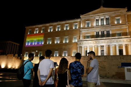 A rainbow flag is projected on the Greek parliament building during a Gay Pride parade in Athens, Greece June 9, 2018. REUTERS/Costas Baltas