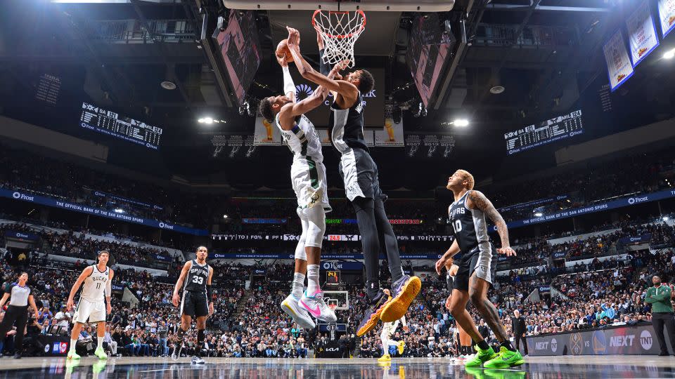 Wembanyama denies Antetokounmpo at the rim. - Michael Gonzales/NBAE/Getty Images