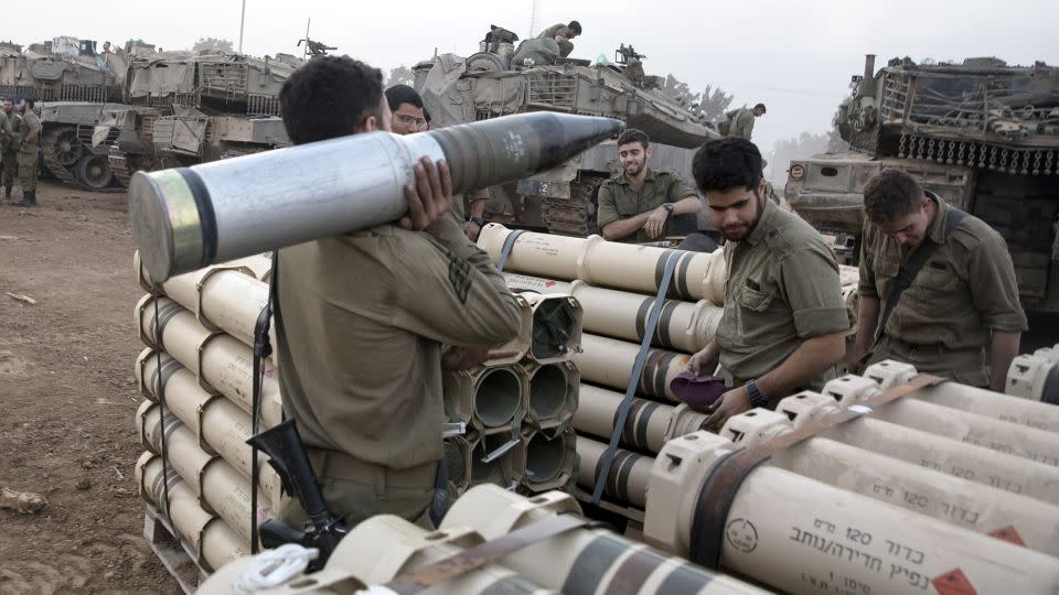 Israeli soldiers organize tank shells after returning from the Gaza Strip at the southern border, Israel on January 1. - Amir Levy/Getty Images