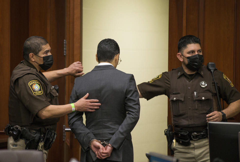 Victor Hugo Cuevas, a 26-year-old linked to a missing tiger named India, is taken into custody after his bond in a separate murder charge was revoked and reset at $300,000 at Fort Bend County Justice Center on Friday, May 14, 2021, in Richmond, Texas. (Godofredo A. Vásquez/Houston Chronicle via AP)