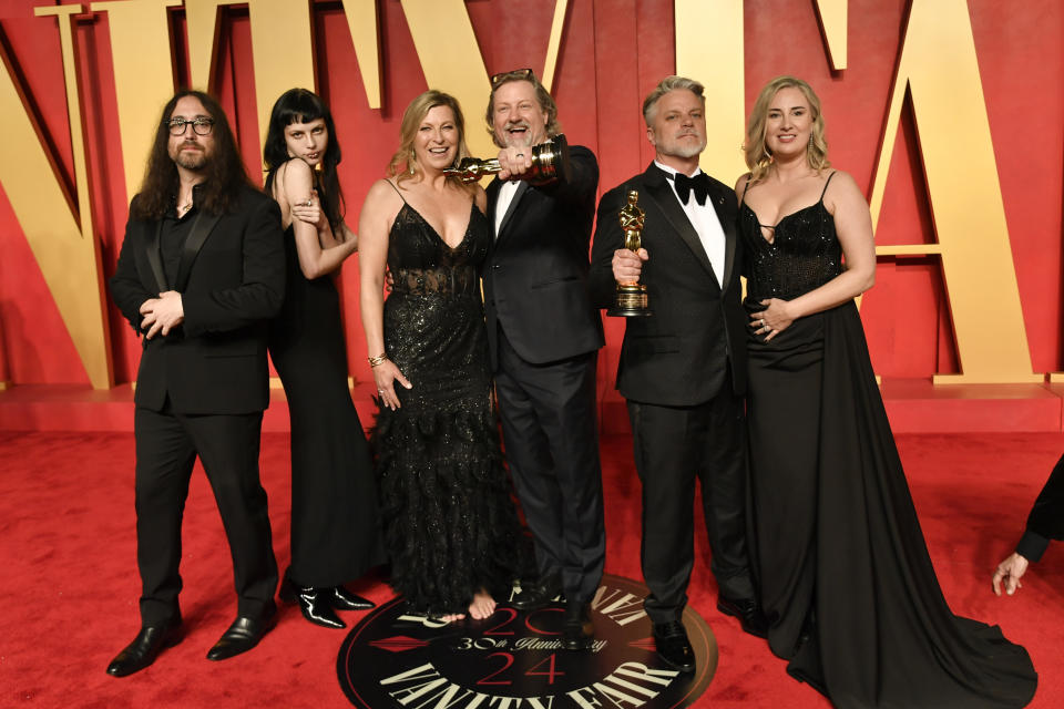 Sean Lennon, from left, Kemp Muhl, a guest, Dave Mullins, Brad Booker, and a guest arrive at the Vanity Fair Oscar Party on Sunday, March 10, 2024, at the Wallis Annenberg Center for the Performing Arts in Beverly Hills, Calif. (Photo by Evan Agostini/Invision/AP)