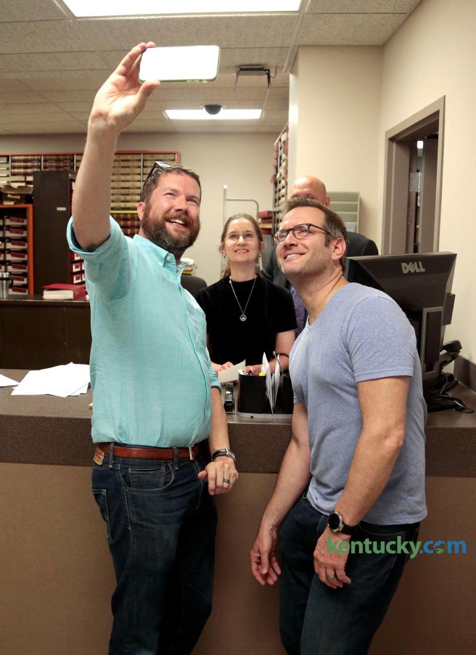 Marcus Roland, right, and Scott Shive, left, took a photo with deputy clerk Lisa Hamm and Fayette Co. Clerk Don Blevins after they received their marriage license in Blevins’ office in Lexington, Ky., Friday, June 26, 2015. The couple was one of the first to get their marriage license in Fayette County after a 2015 Supreme Court ruling. This weekend Roland is directing a play with close ties to his own story.