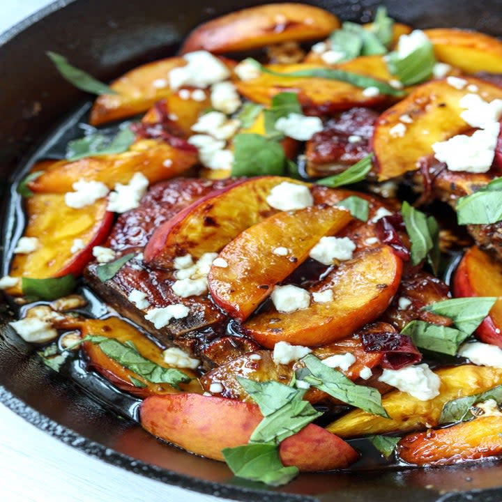 Ripe peaches, tangy feta cheese, sweet balsamic, and fresh basil are the perfect complement to grilled pork chops. Everything cooks in a single skillet, so you don't have to worry about all the clean up. Recipe: Skillet Balsamic Peach Pork Chops