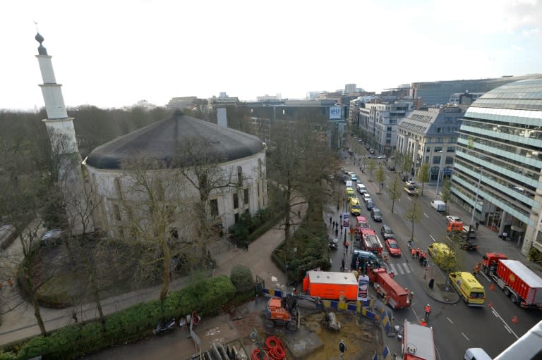 A picture taken on November 26, 2015 shows ambulances, police and fire fighter vehicles outside the mosque after a suspect letter with powder was found at the Great Mosque in Brussels on November 26, 2015