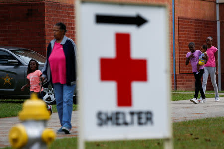 People arrive to a shelter run by Red Cross before Hurricane Florence comes ashore in Washington, North Carolina, U.S., September 13, 2018. REUTERS/Eduardo Munoz