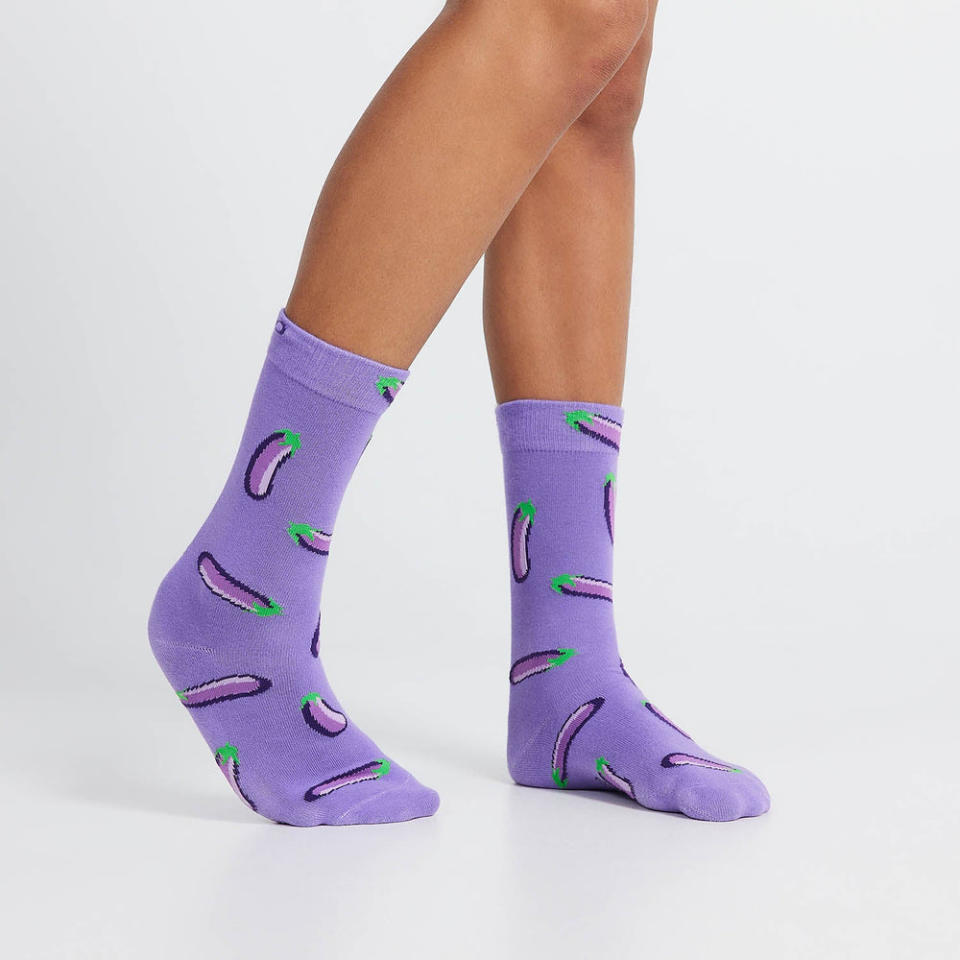 Legs seen from knee down wearing purple Eggplant Emoji socks, $19.