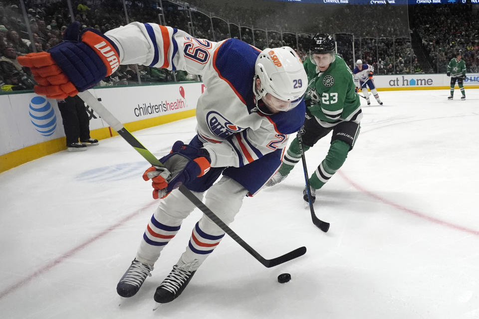 Edmonton Oilers center Leon Draisaitl (29) skates with the puck against Dallas Stars defenseman Esa Lindell (23) during the second period an NHL hockey game in Dallas, Saturday, Feb. 17, 2024. (AP Photo/LM Otero)