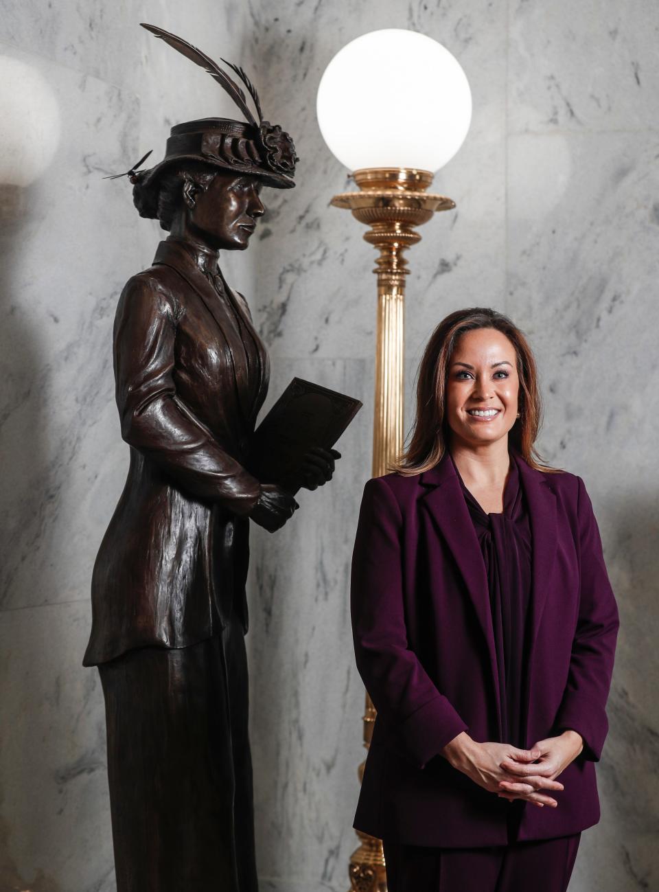 Kentucky Lt. Governor Jacqueline Coleman stands next to the statue of Nettie Depp, an inspiration to Coleman. Depp was an educator who later became superintendent of Barren County Schools.