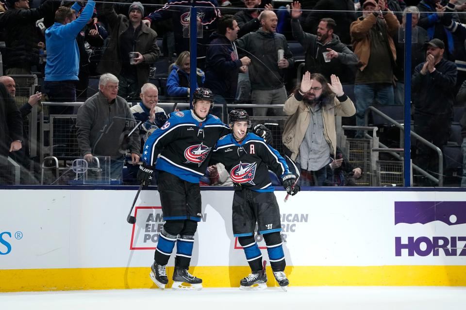 Jan 31, 2023; Columbus, Ohio, USA;  Columbus Blue Jackets left wing Patrik Laine (29) celebrates a goal by left wing Johnny Gaudreau (13) during the third period of the NHL hockey game against the Washington Capitals at Nationwide Arena. The Blue Jackets lost 4-3 in overtime. Mandatory Credit: Adam Cairns-The Columbus Dispatch