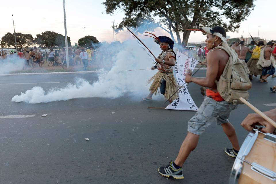 One policeman was shot in the leg by an arrow