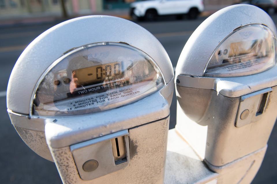 Parking meters in downtown York City allow for payment by coins and the ParkMobile app.