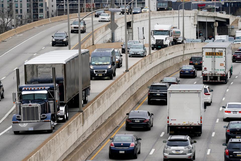 Heavy trucks and other vehicles move along Interstate 76 highway in Philadelphia, on March 31, 2021. (Credit: Matt Rourke/Associated Press/File)
