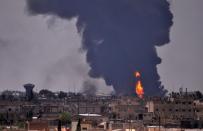 Smoke billows in the northeastern Syrian city of Hasakeh on June 28, 2015 following a reported mortar attack by Islamic State (IS) group