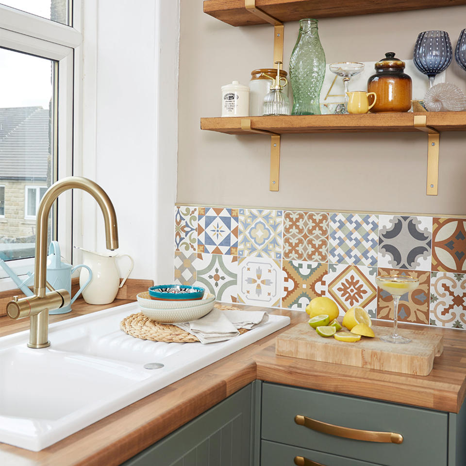 green painted kitchen with shelves