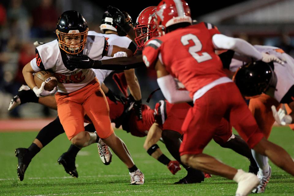 Cocoa's Jayvan Boggs (88) rushes for yards against Bradford's Jaylin Maiden (5).