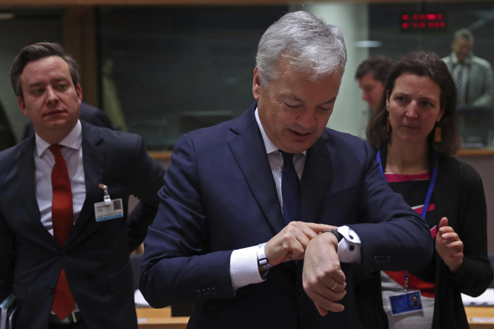 Belgium's Foreign Minister Didier Reynders looks at his watch prior a meeting of EU Foreign Affairs ministers at the European Council headquarters in Brussels, Monday, Dec. 10, 2018. (AP Photo/Francisco Seco)