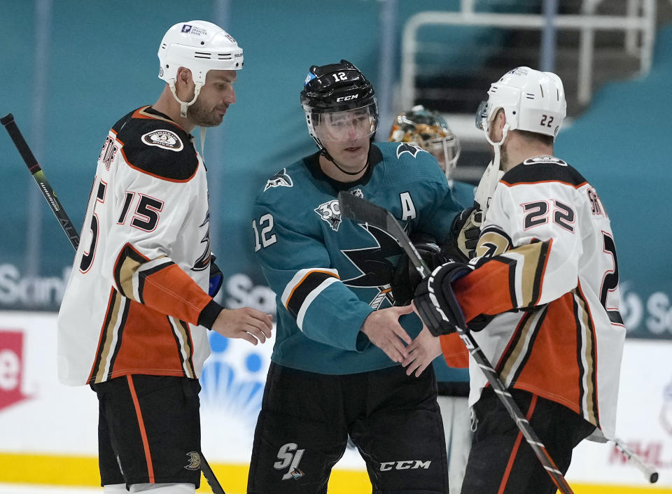 Anaheim Ducks defenseman Kevin Shattenkirk (22) and center Ryan Getzlaf (15) shakes hands with San Jose Sharks center Patrick Marleau (12) after an NHL hockey game Wednesday, April 14, 2021, in San Jose, Calif. (AP Photo/Tony Avelar)