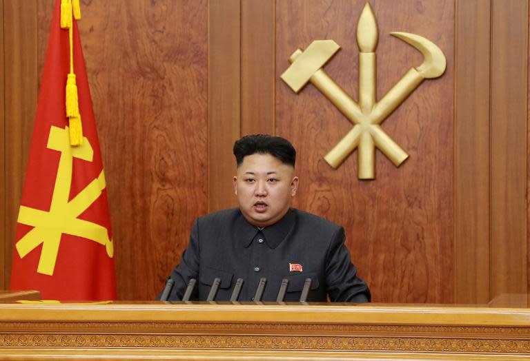 KCNA handout photo taken on January 1, 2014 shows North Korean leader Kim Jong-Un delivering his New Year's Day address in Pyongyang