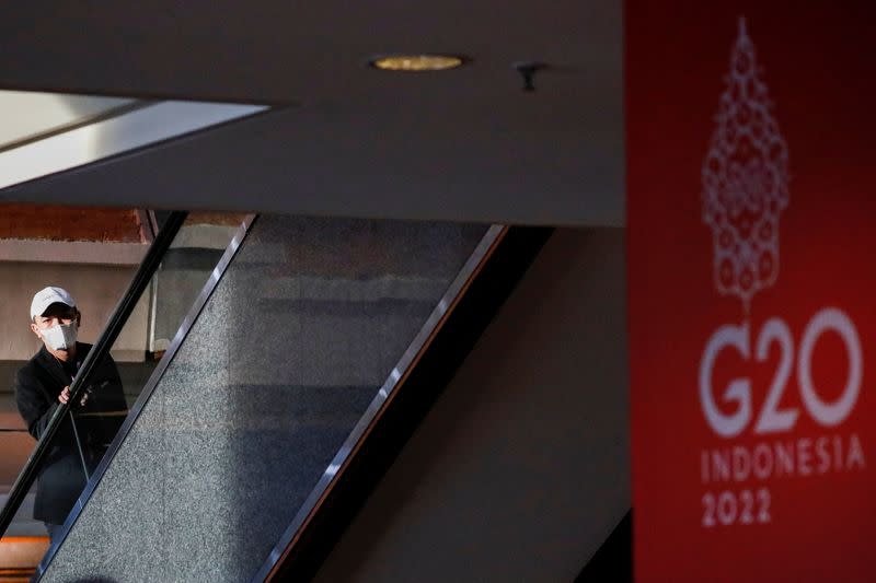 A man stands on an escalator ahead of the G20 summit in Nusa Dua